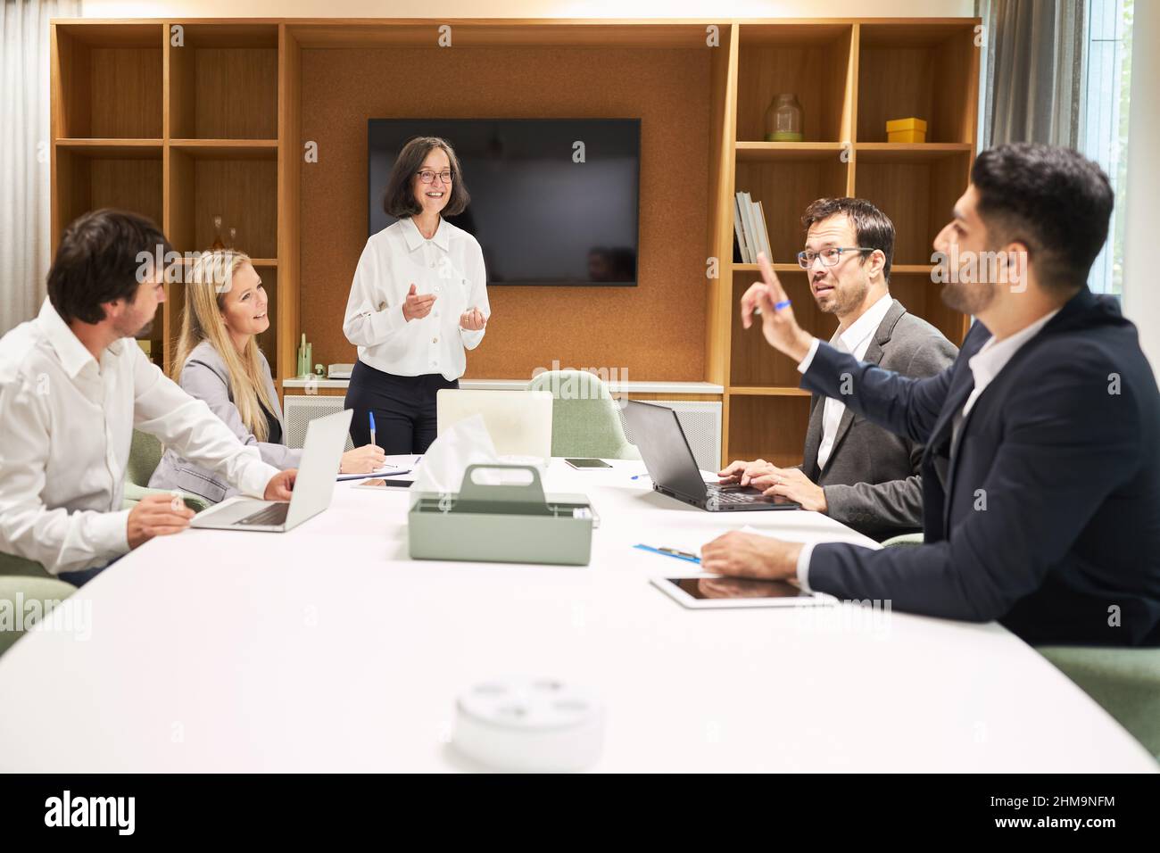 Start-up business team in the conference room in a discussion on ...
