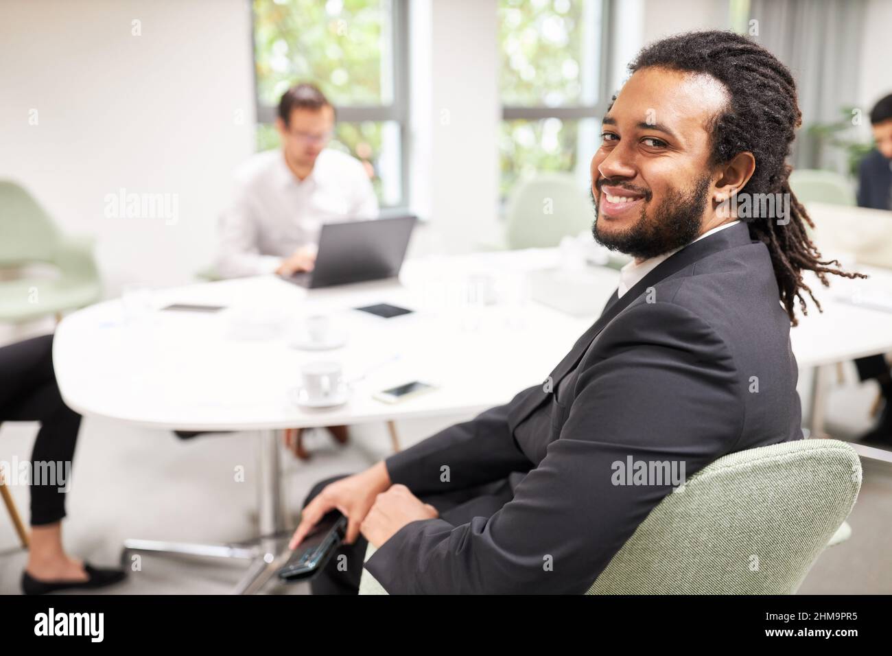 African businessman as a successful startup founder at the conference ...
