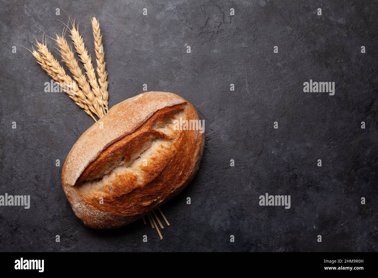 Fresh homemade bread on stone table. Top view flat lay with copy space ...
