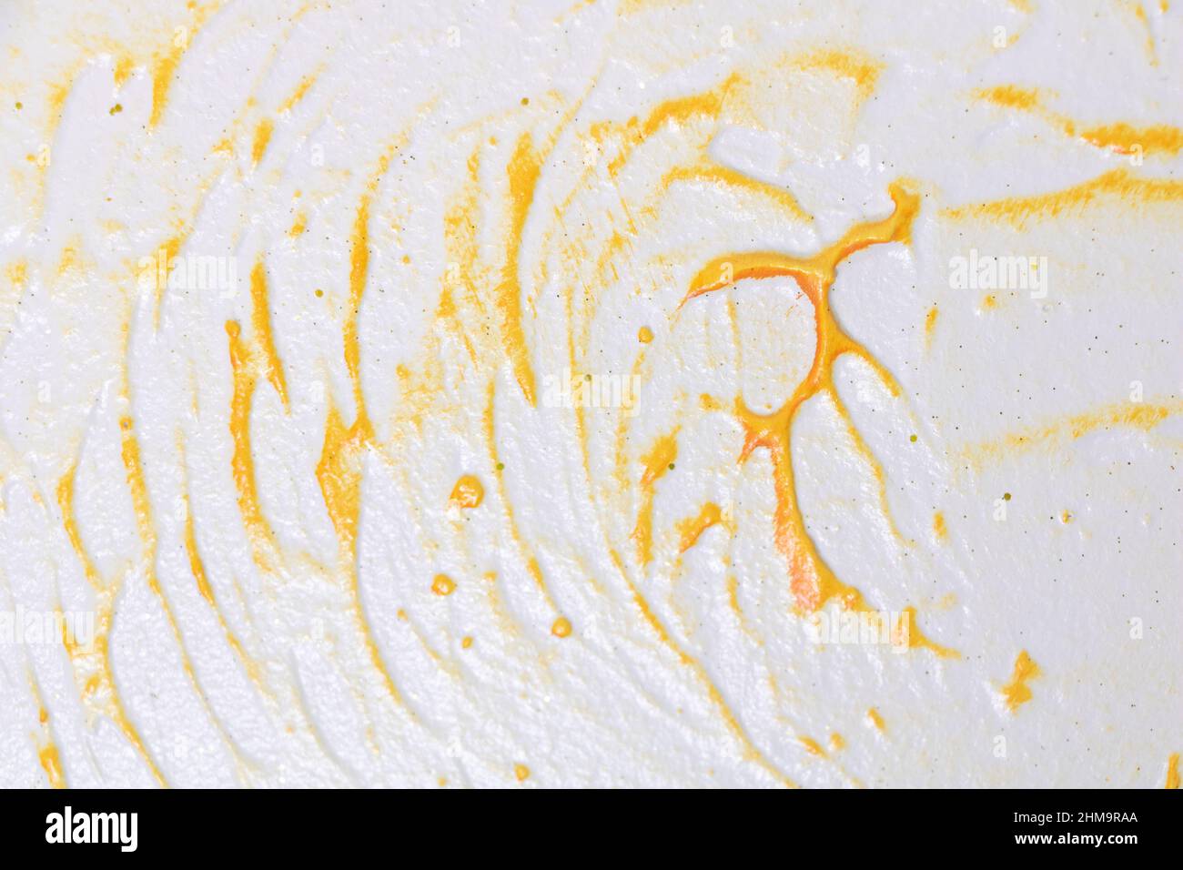 Close up shot of a wall texture design with white and orange color ...