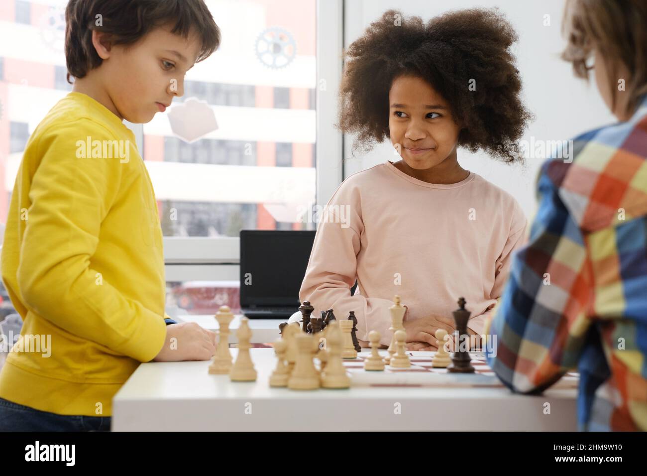 Young white child playing a game of chess on large chess board. Chess board  on table in front of school boy thinking of next move by Len44ik Vectors &  Illustrations with Unlimited