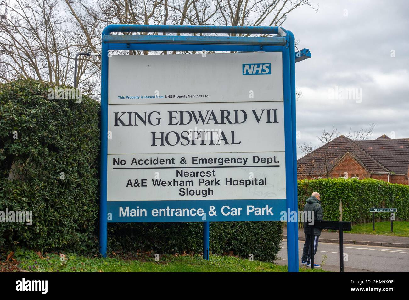 Road sign directing visitors to the main entrance and car park of The