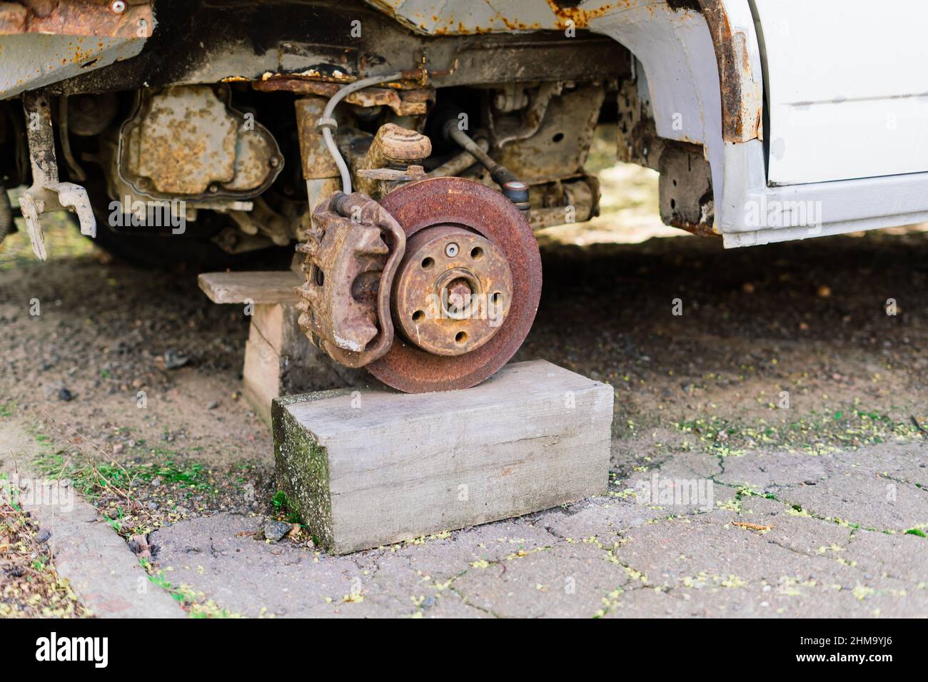 Old rusty car wheel. Cracked tires and a rusted hubcaps Stock Photo Alamy