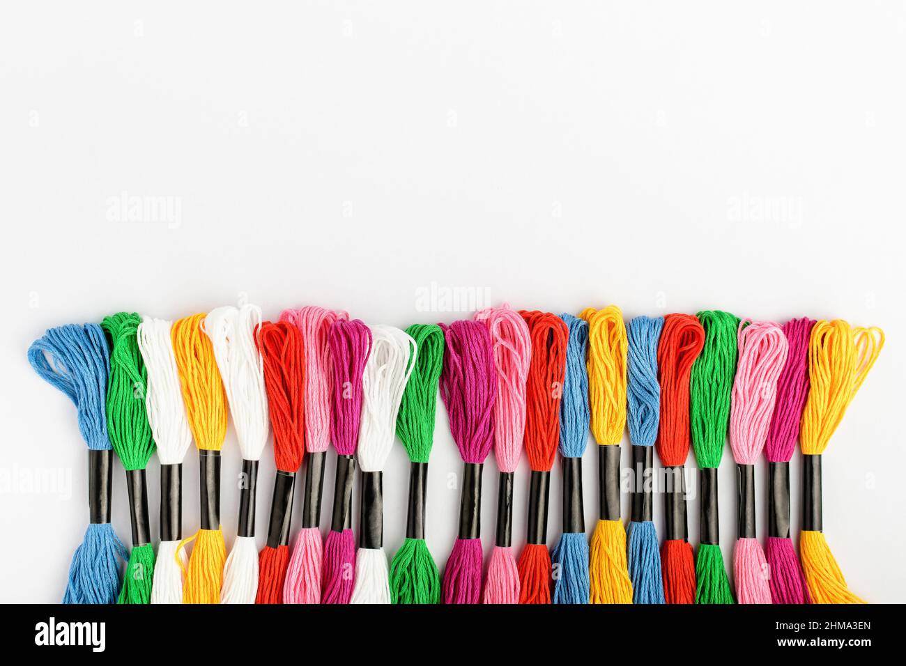 Line with many mixed vivid colored sewing threads for embroidery ...