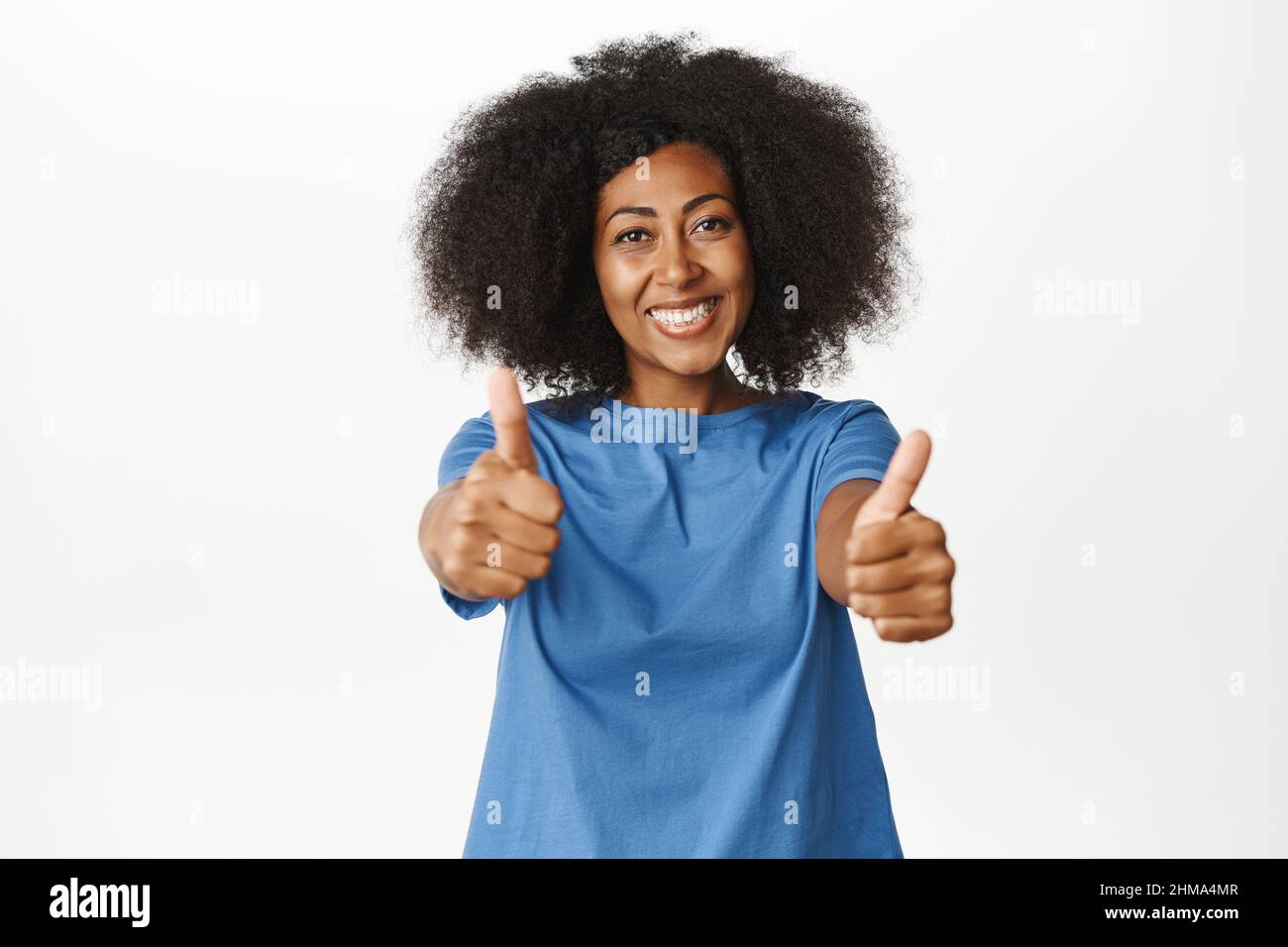 Like. Smiling african american woman showing thumbs up in approval ...