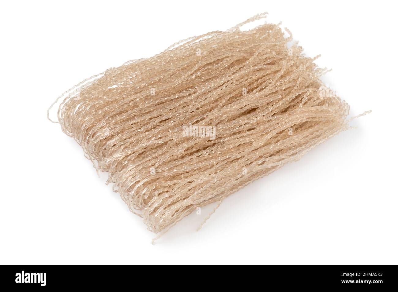 Bunch of raw sweet potato starch glass noodle, Dangmyeon,  isolated on white background Stock Photo