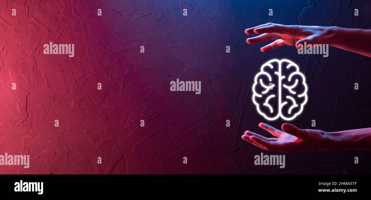 Male hand holding brain icon on neon red,blue background. Artificial ...