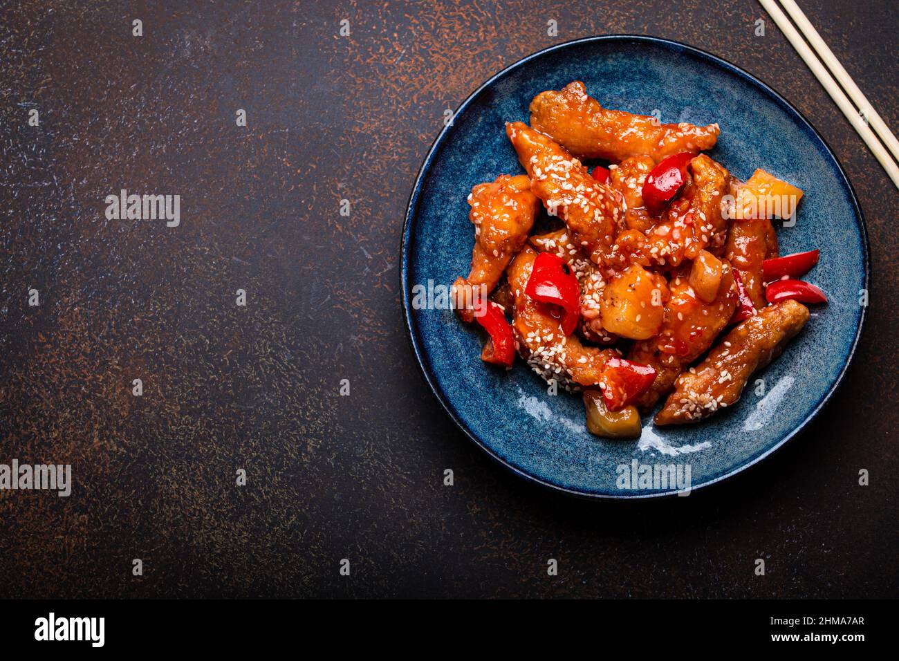 Chinese traditional wok dish sweet and sour deep fried chicken with vegetables stir-fry on plate Stock Photo