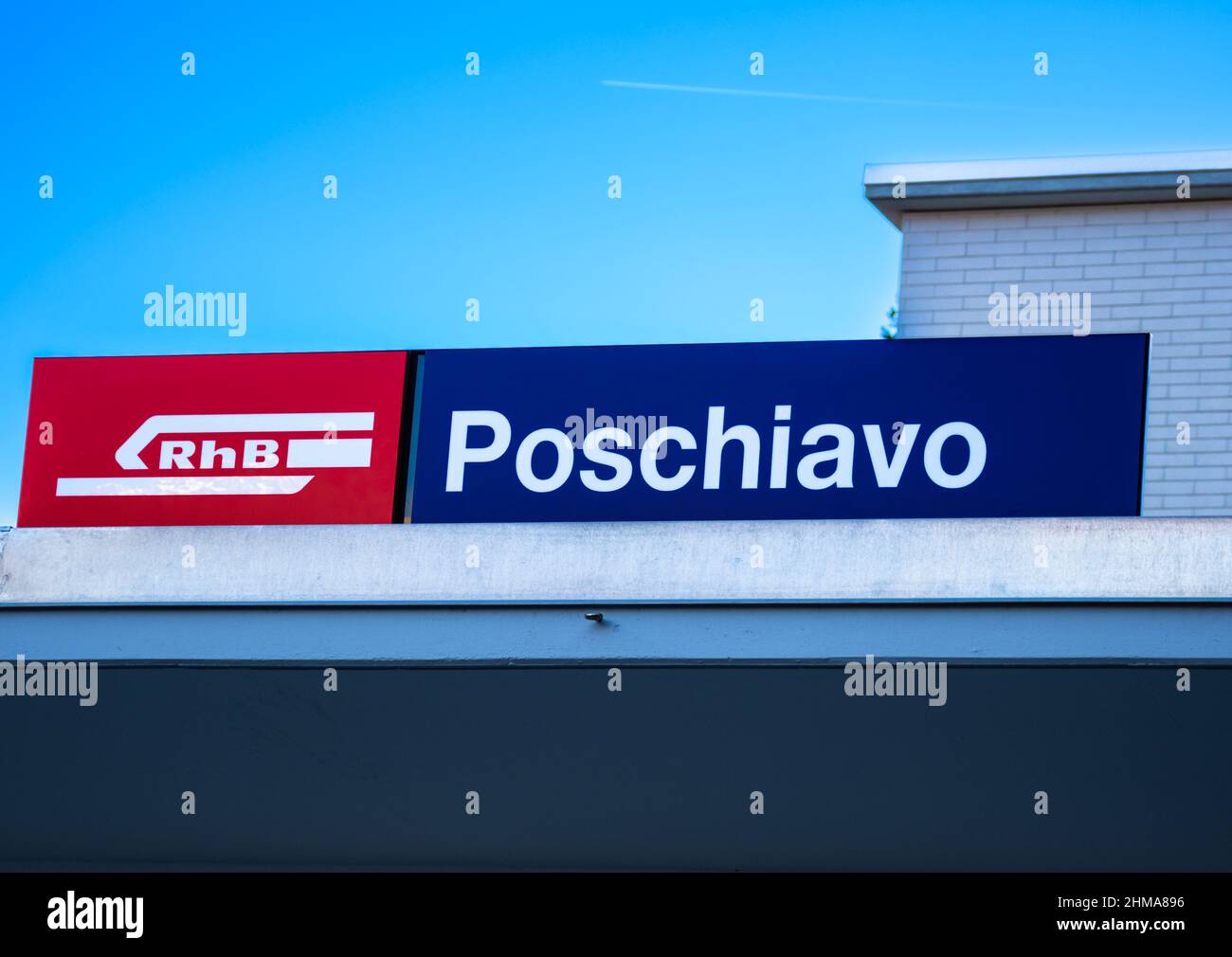 Poschiavo, Switzerland - January 19, 2022: A sign of the railway station of Poschiavo and a logo of Rhaetian railway, Unesco heritage Stock Photo