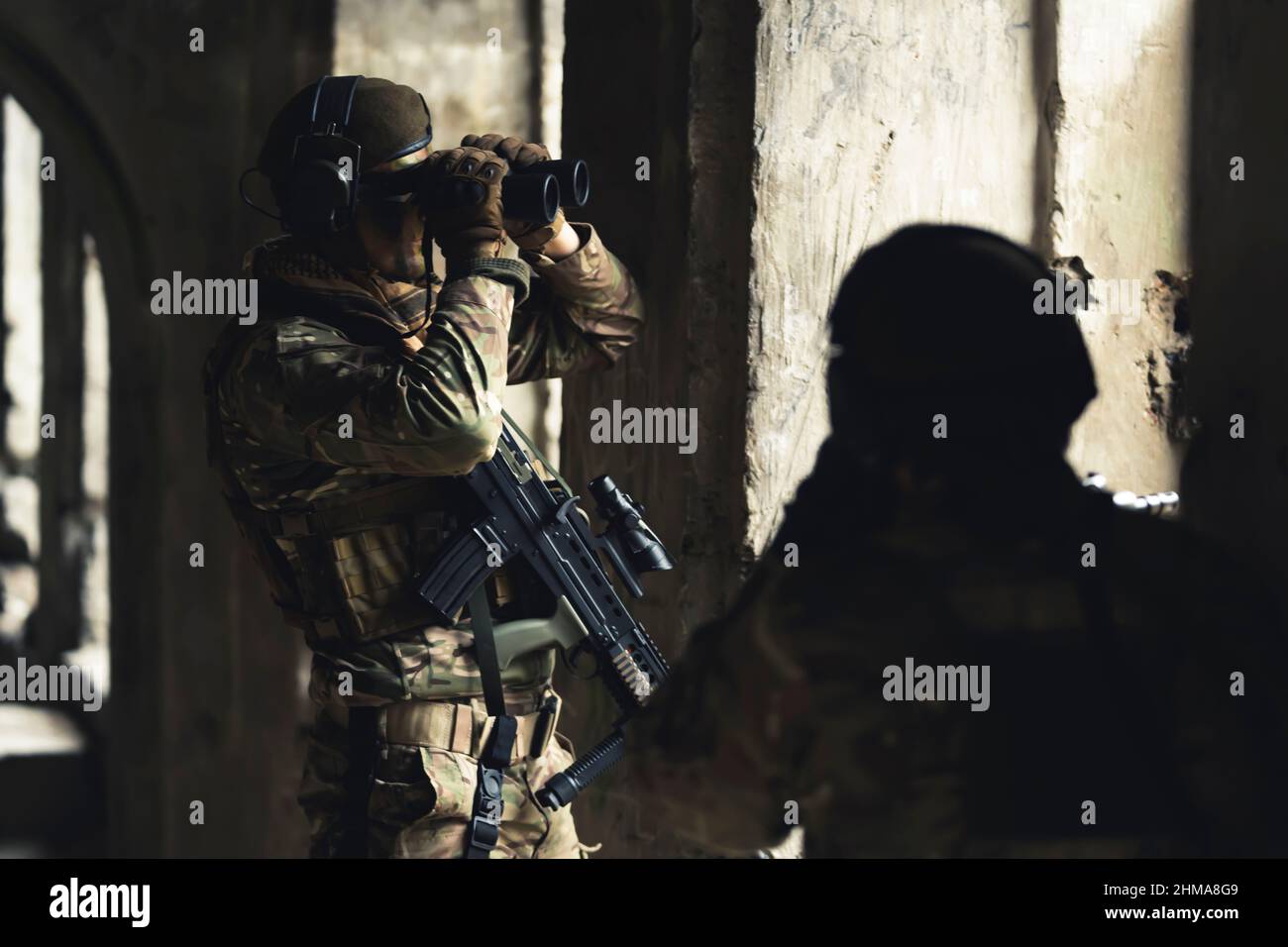 Vulnerable postion of duo soldiers stuck at a building . High quality photo Stock Photo