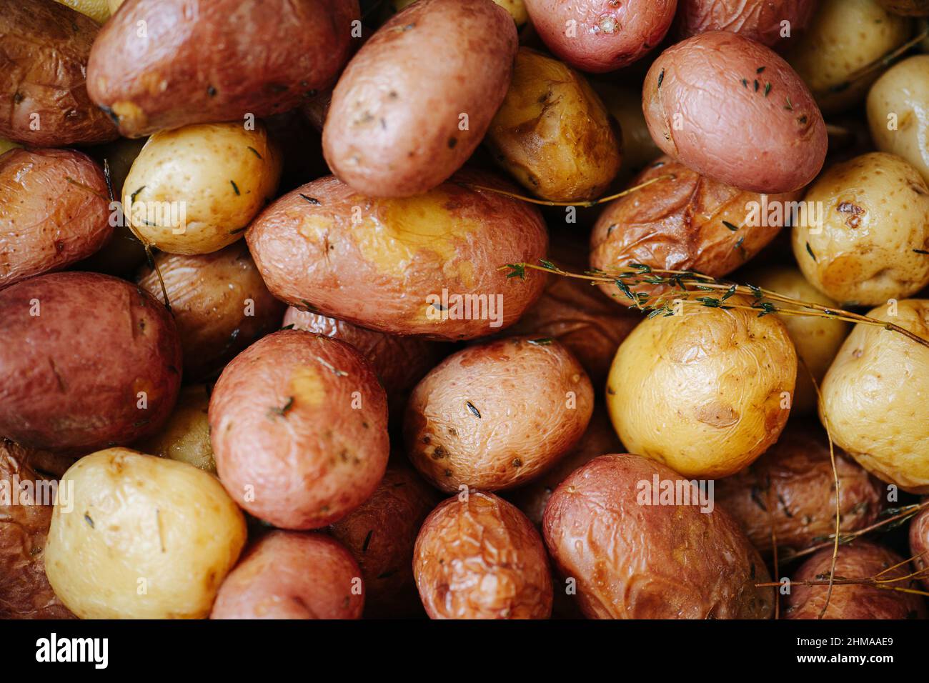Baked potatoes in a texture. With red and yellow skin Stock Photo - Alamy