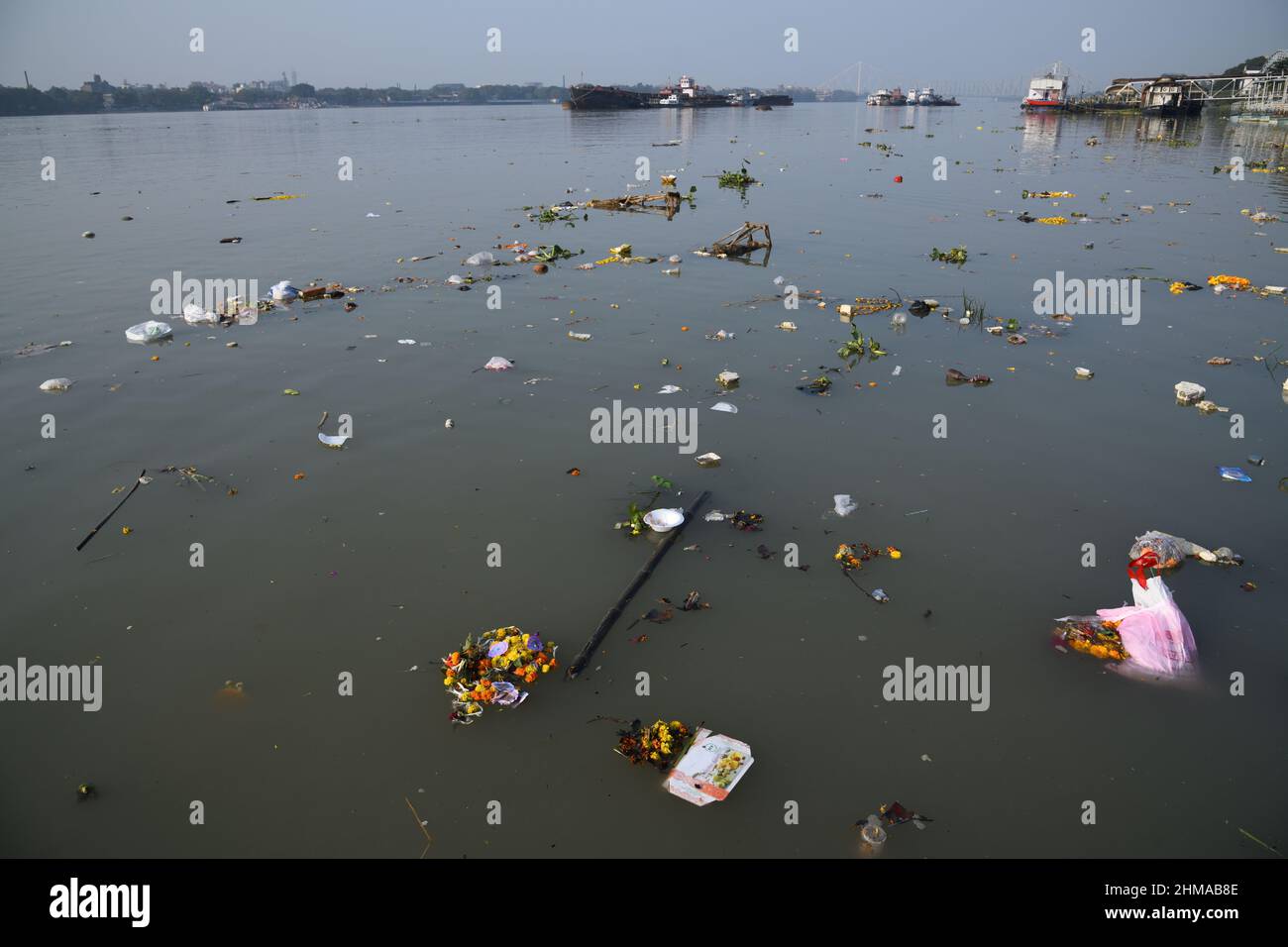 Floating garbage due to idol immersion on the Ganges water, Kolkata, West Bengal, India. Stock Photo