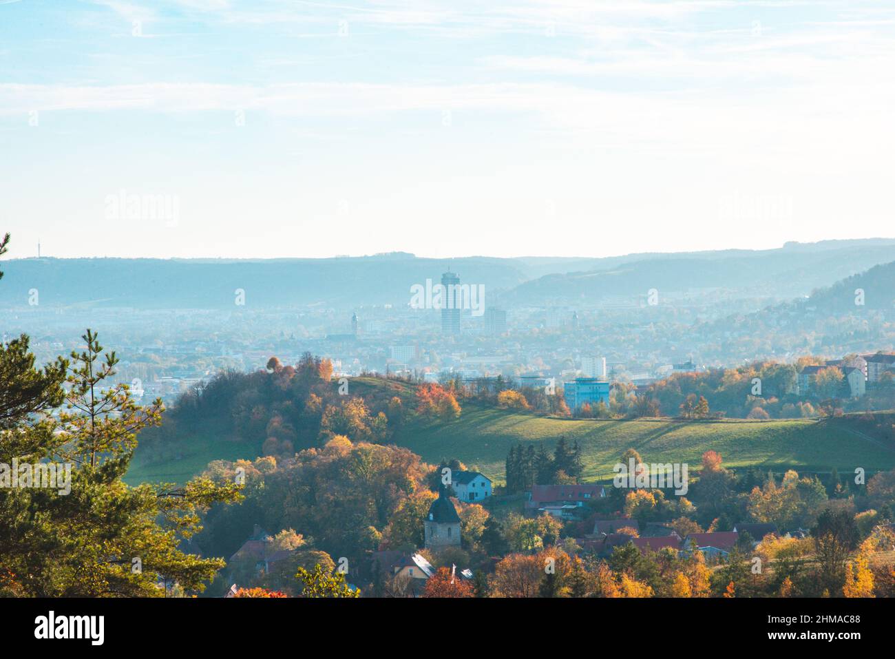 City Jena in Germany surrounded by mountains with Jentower at sunset Stock Photo