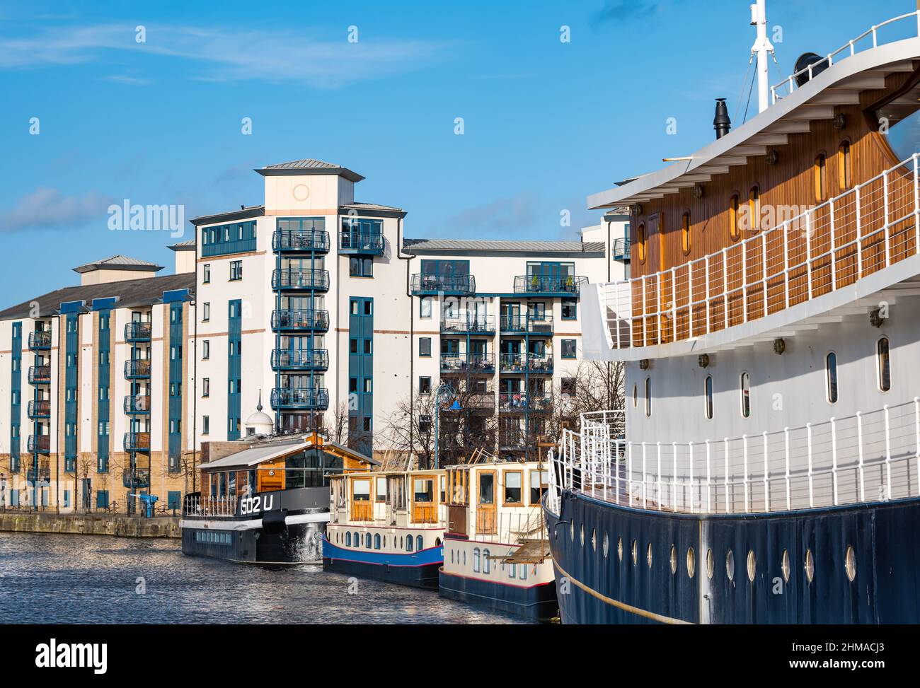 Floating Hotel Ocean Mist & houseboats on Water of Leith river in sunshine, Leith, Edinburgh Floating Hotel Ocean Mist & houseboats on Water of Leith river in sunshine, Leith, Edinburgh