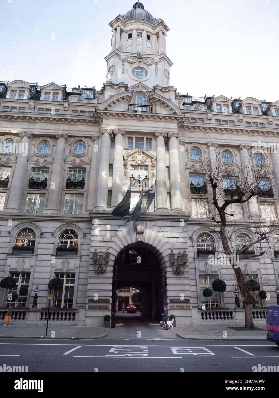 Rosewood luxury hotel, London, with dog walker Stock Photo