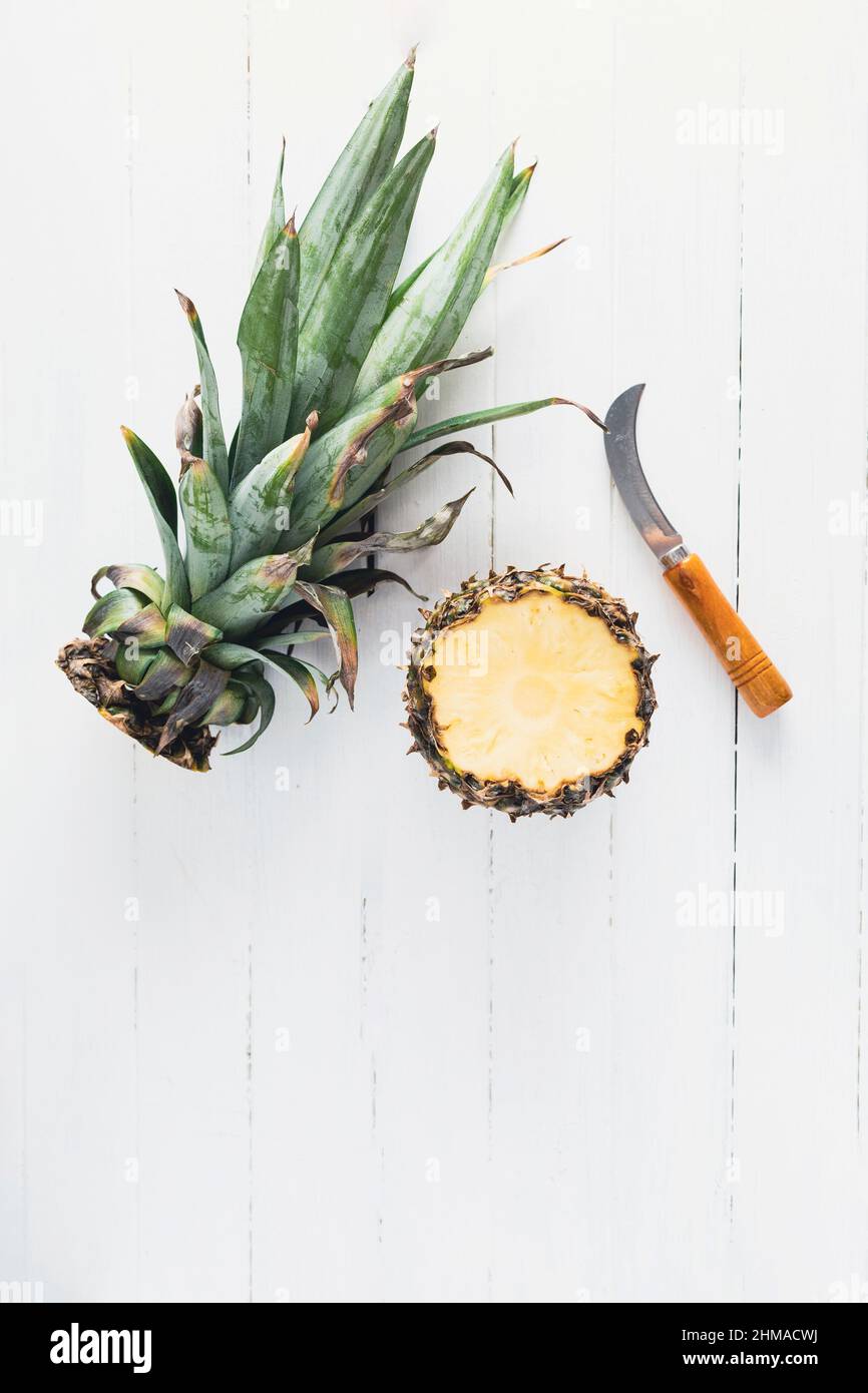Pineapple on white wood board with copy space Stock Photo