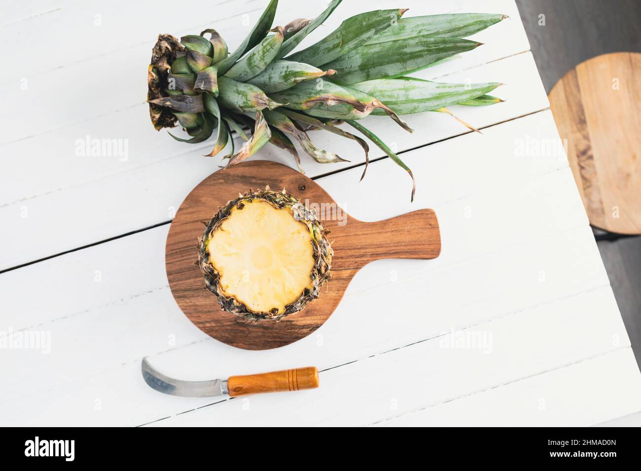 Pineapple on white wood background. Pineapple with copy space Stock Photo