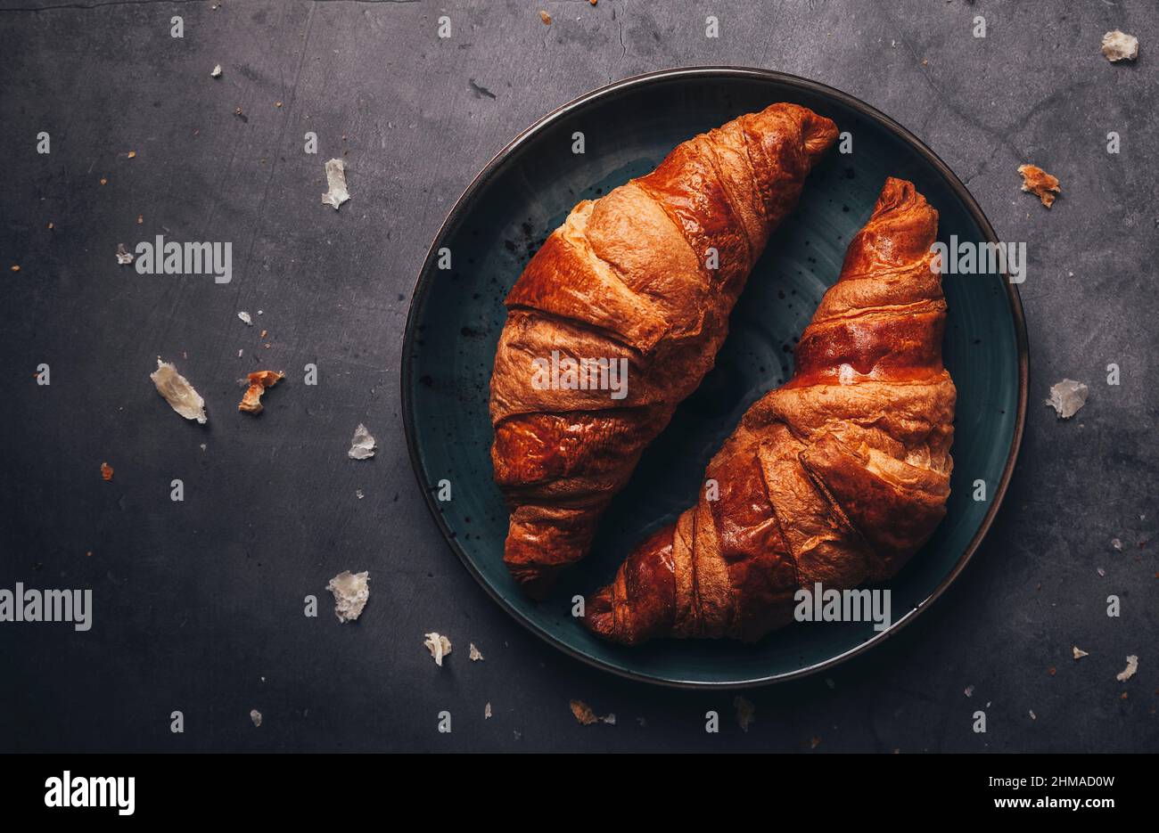 Plate with croissants on a black surface Stock Photo