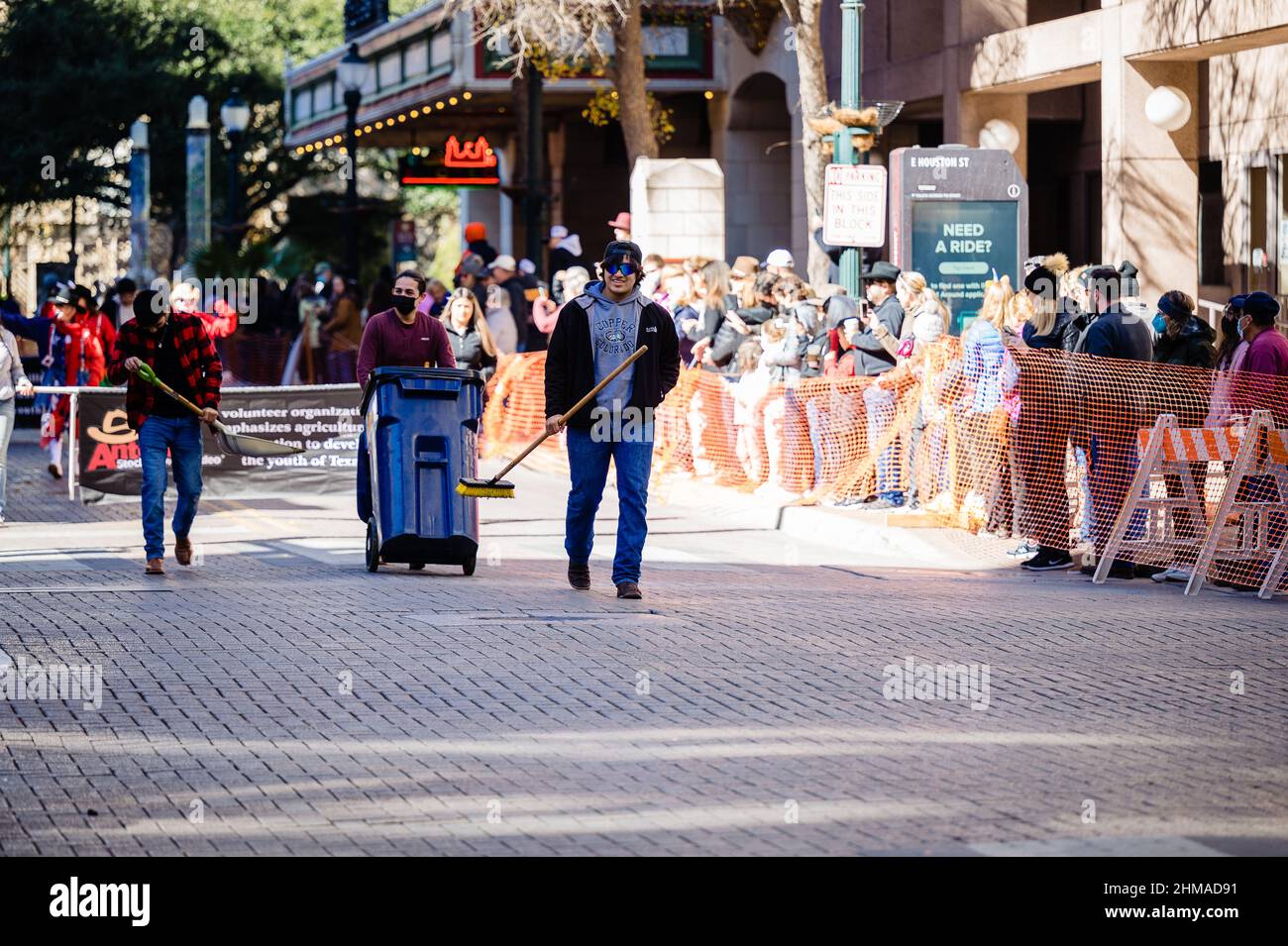 pooper scoopers on san antonio cattle drive parade route Stock Photo