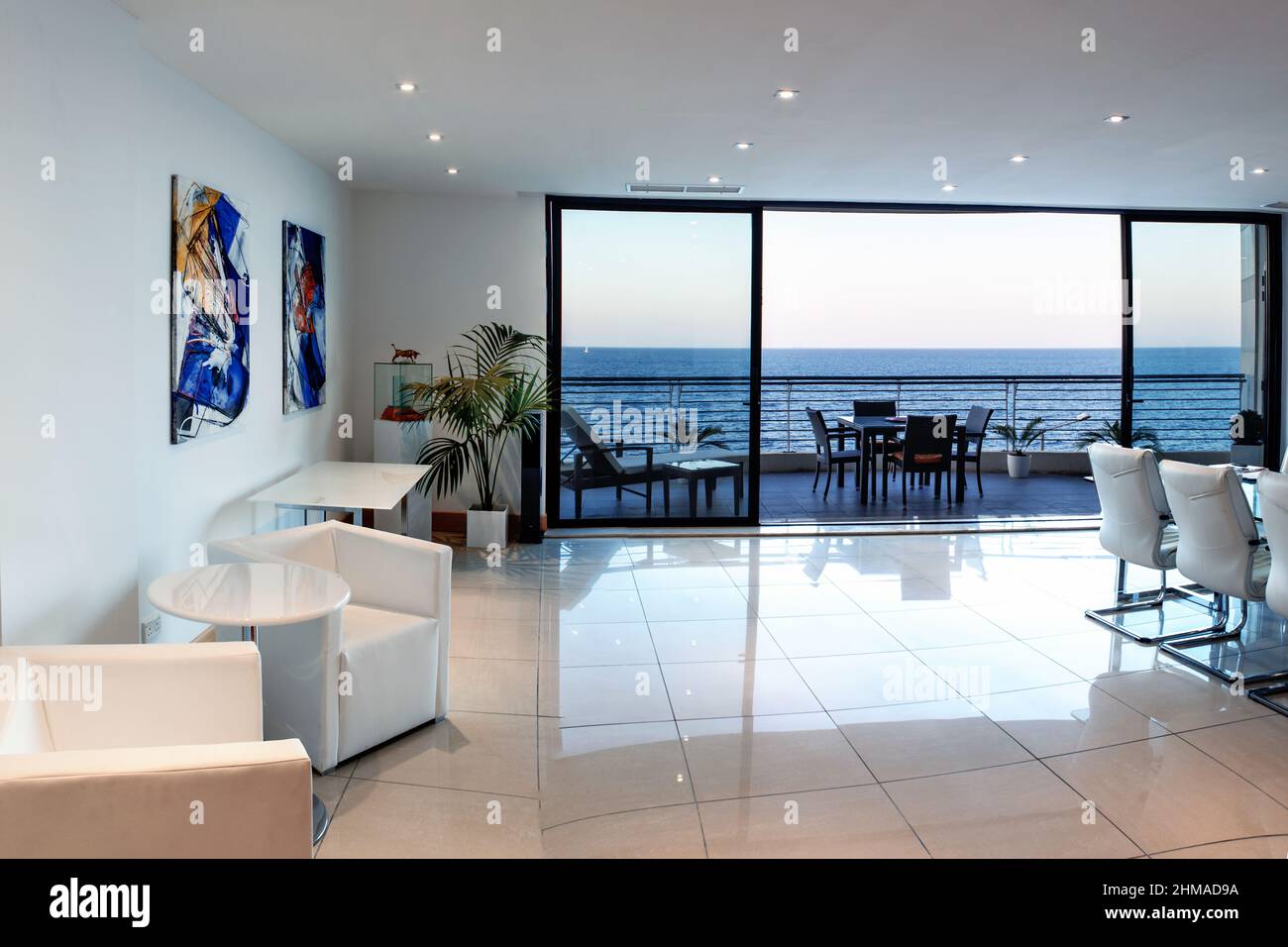 Modern Interior with Ocean Front Balcony Stock Photo - Alamy