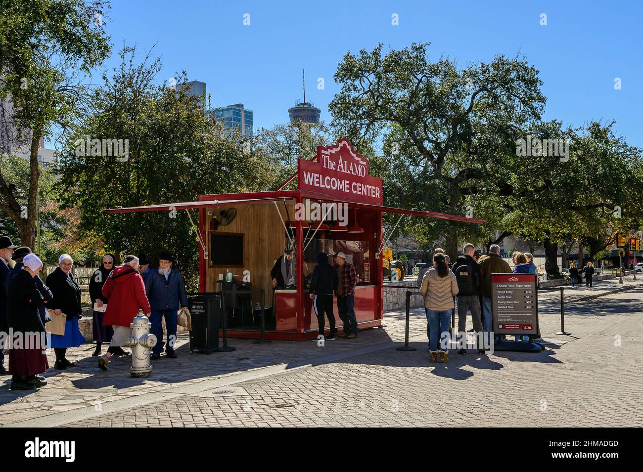 the alamo welcome center with hemisfair tower in background Stock Photo