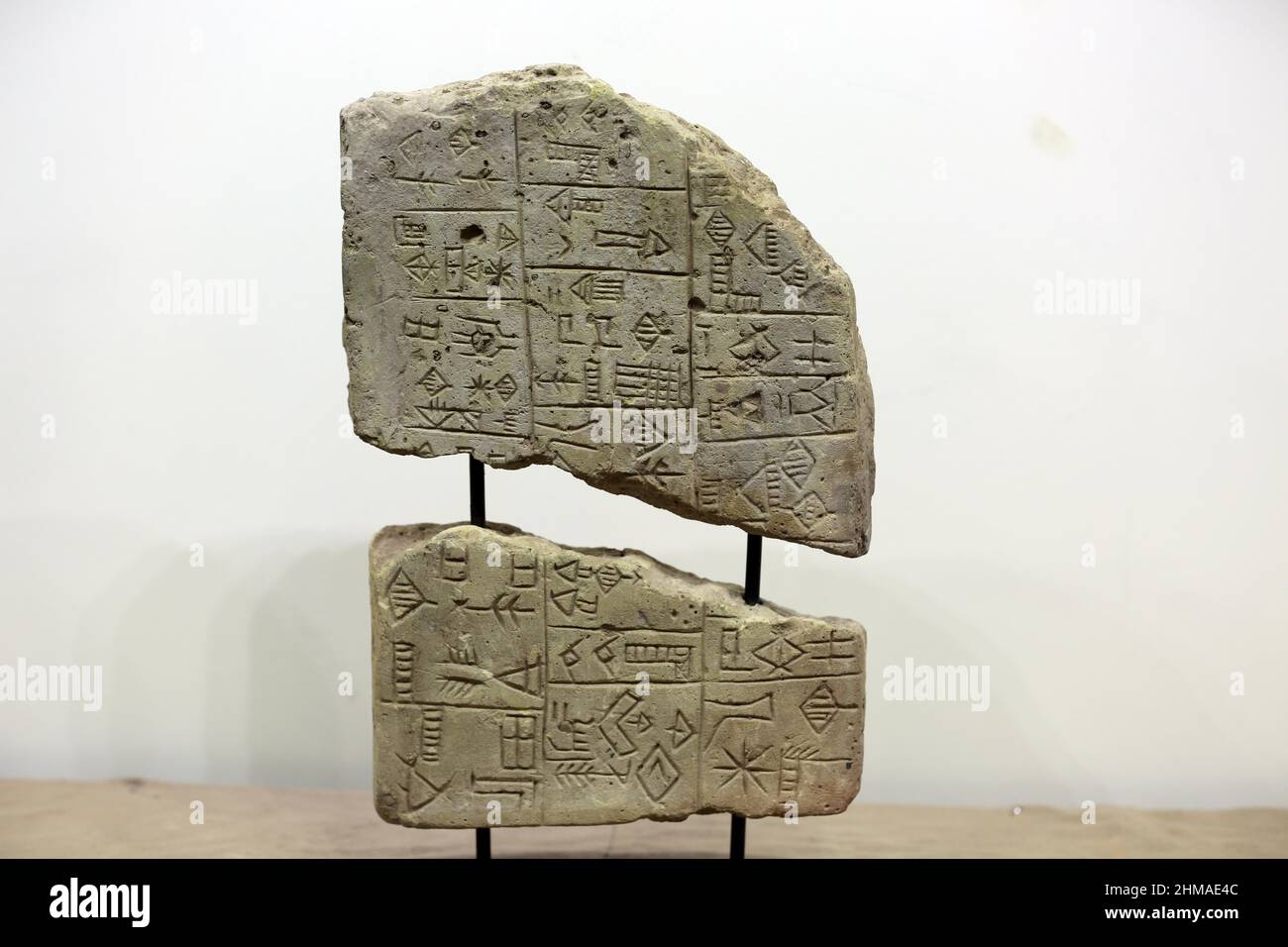 Baghdad, Iraq. 8th Feb, 2022. A cuneiform tablet is displayed at a museum in Baghdad, Iraq, Feb. 8, 2022. The Iraqi authorities on Monday retrieved from Lebanon 337 ancient artifacts which were looted after the U.S.-led invasion of Iraq in 2003. Credit: Khalil Dawood/Xinhua/Alamy Live News Stock Photo