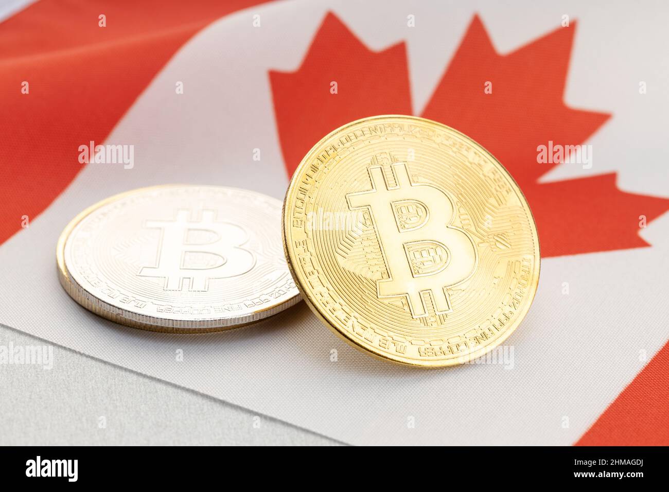 Bitcoin cryptocurrency coins on national flag of Canada. Crypto law