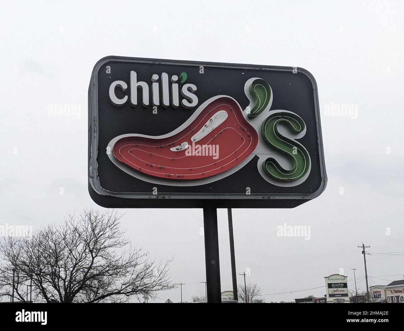 Chili's restaurant sign outdoors under a cloudy sky Stock Photo