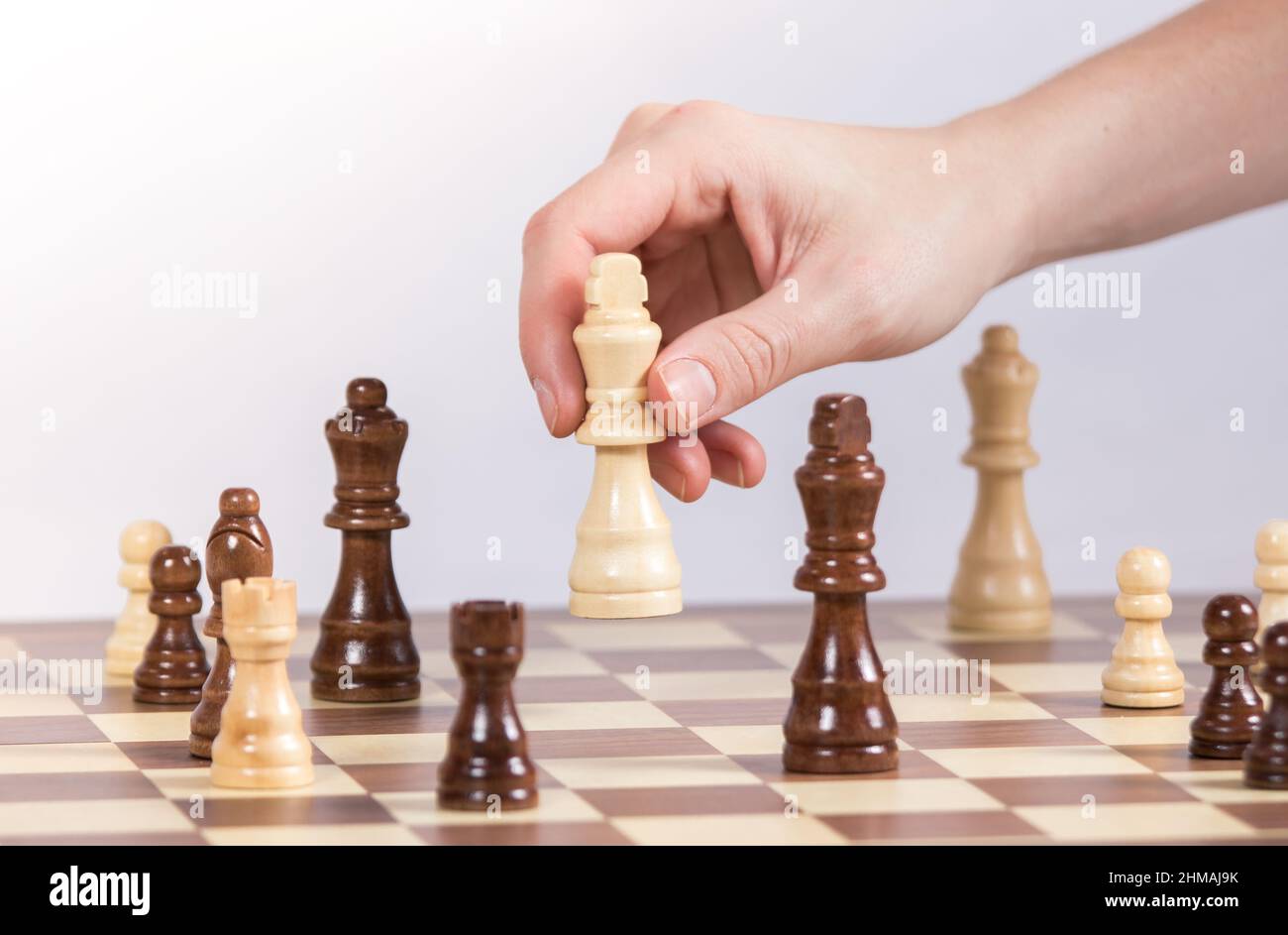 A Man Hand with a Chess Piece in a Board Game. Opening of the Chess Game  with the Move of the White King Pawn E2-e4, Copy Space on Stock Image -  Image