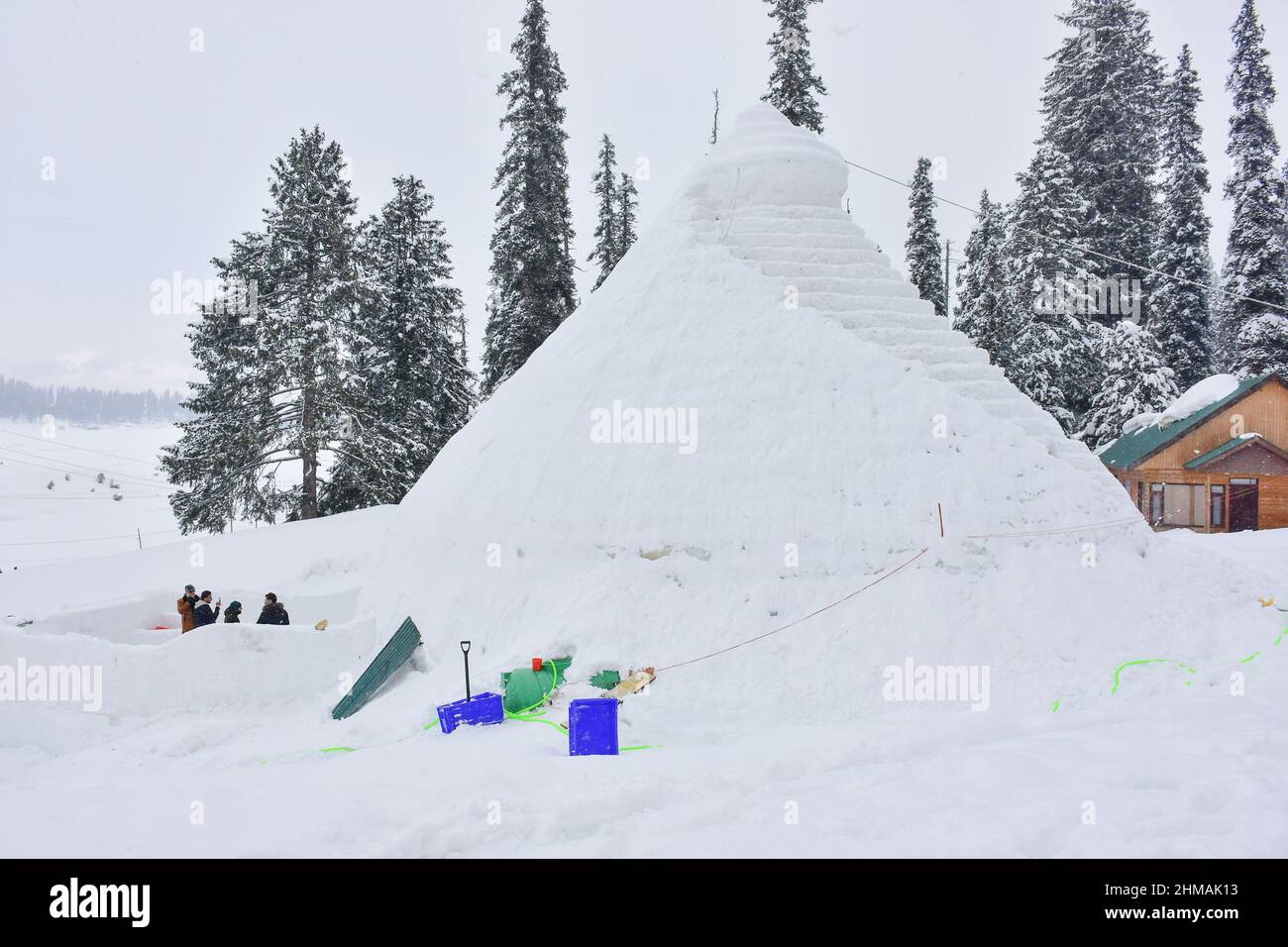 Gulmarg, India. 08th Feb, 2022. Exterior of the cafe. An igloo cafe, claimed to be the world's largest, has come up at the famous ski-resort of Gulmarg in Jammu and Kashmir. With a height of 37.5 feet and a diameter of 44.5 feet, Wasim, creator of the igloo, claimed it was the world's largest cafe of its kind. It took 64 days to complete it with 25 people working day and night, Mr Wasim said, adding that it took 1,700 man-days to complete the project. Credit: SOPA Images Limited/Alamy Live News Stock Photo