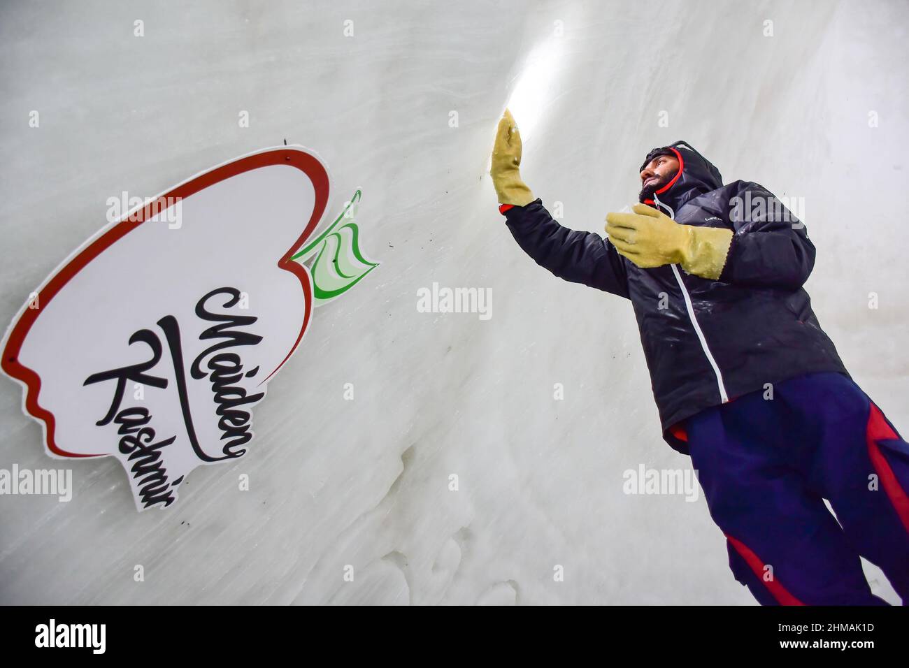 Gulmarg, India. 08th Feb, 2022. A worker retouches the cafe. An igloo cafe, claimed to be the world's largest, has come up at the famous ski-resort of Gulmarg in Jammu and Kashmir. With a height of 37.5 feet and a diameter of 44.5 feet, Wasim, creator of the igloo, claimed it was the world's largest cafe of its kind. It took 64 days to complete it with 25 people working day and night, Mr Wasim said, adding that it took 1,700 man-days to complete the project. Credit: SOPA Images Limited/Alamy Live News Stock Photo