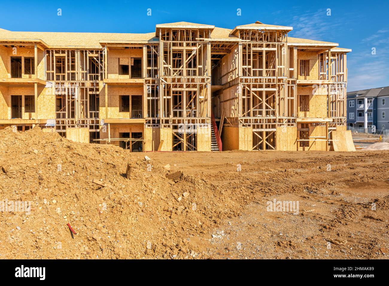 Horizontal shot of a growing apartment community under construction. Stock Photo
