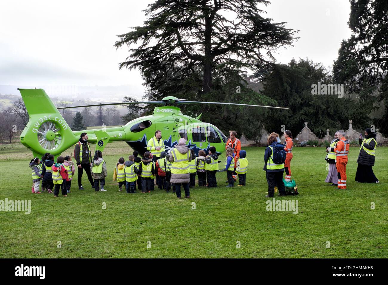 The crew of the Great Western Air Ambulance give an impromptu talk to a group of pre school children after bad weather forced the helicopter to land Stock Photo