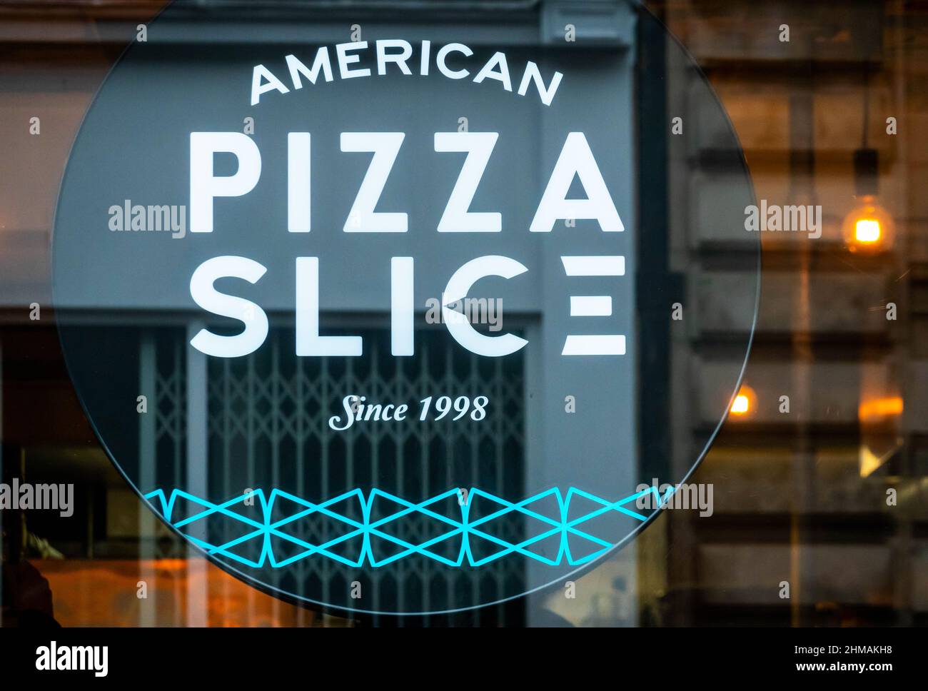 American Pizza Slice sign in the window of their Bold Street pizzeria in Liverpool Stock Photo