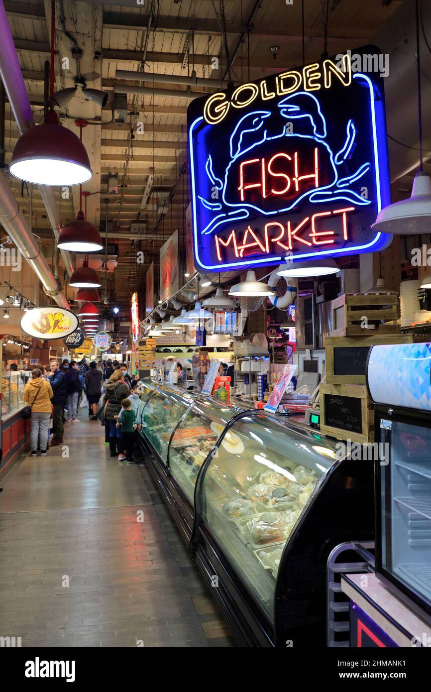 Interior view of Reading Terminal Market with the neon sign of Golden