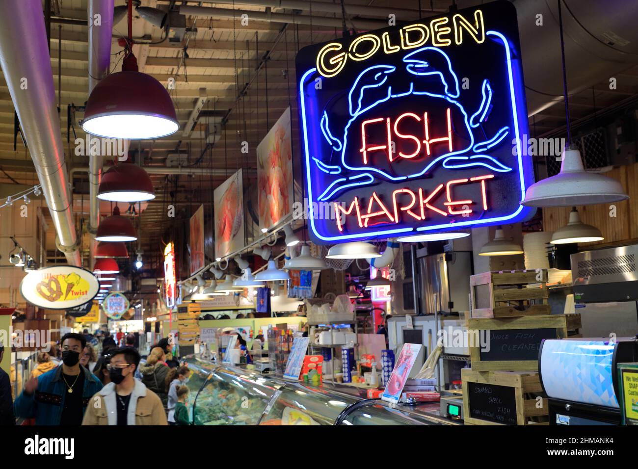 Interior view of Reading Terminal Market with the neon sign of Golden