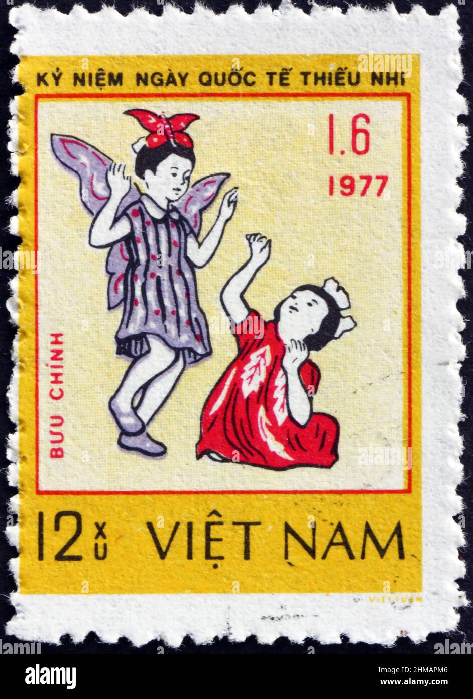 VIETNAM - CIRCA 1978: a stamp printed in Vietnam dedicated to International children’s day, two girls playing, circa 1978 Stock Photo