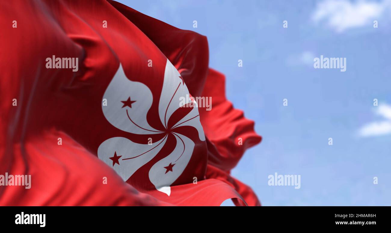 Detail of the civil flag of Hong Kong waving in the wind on a clear day. Selective focus. Hong Kong is a city and special administrative region of Chi Stock Photo