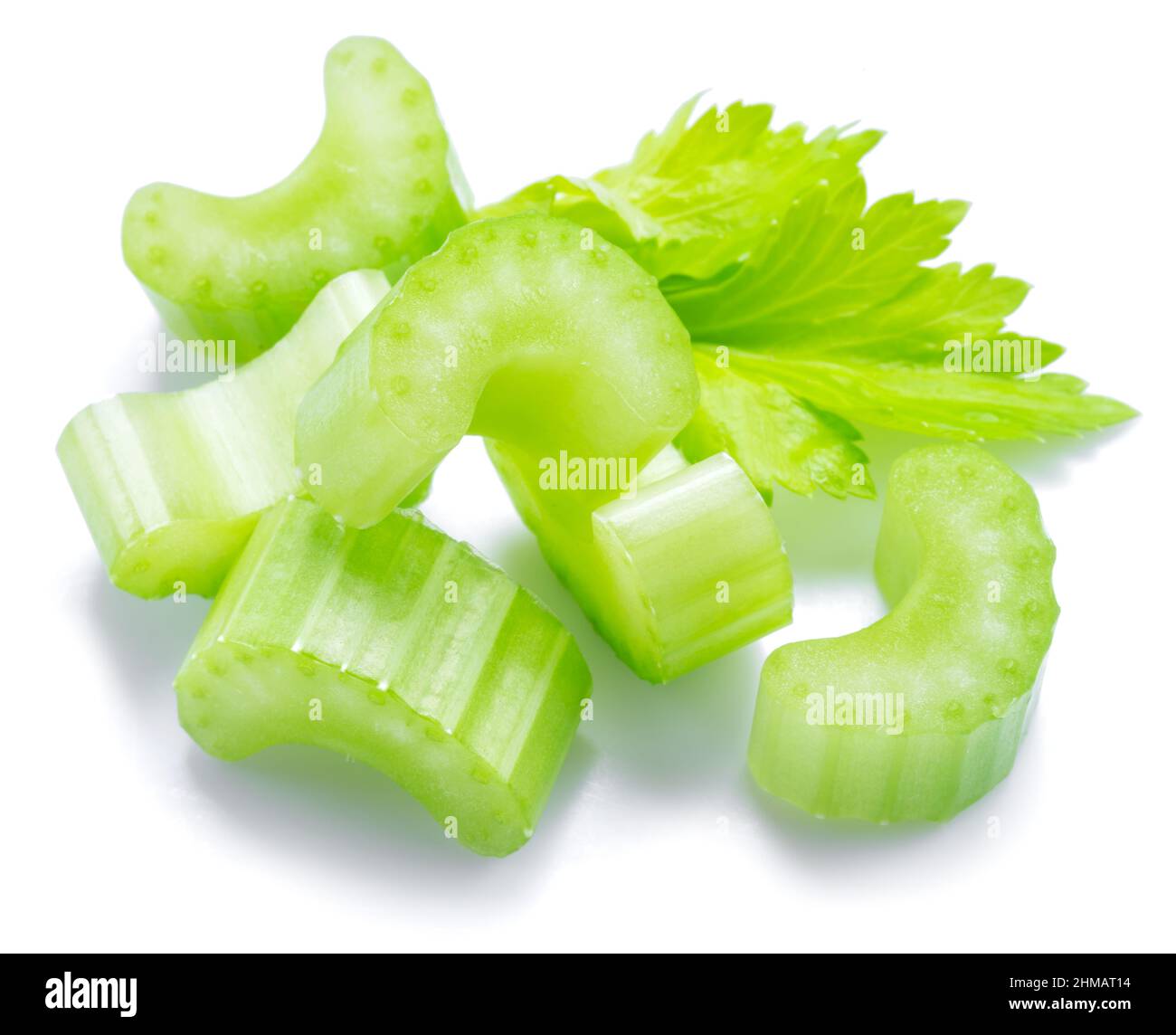 Pile of celery ribs and cuts isolated on white background Stock Photo