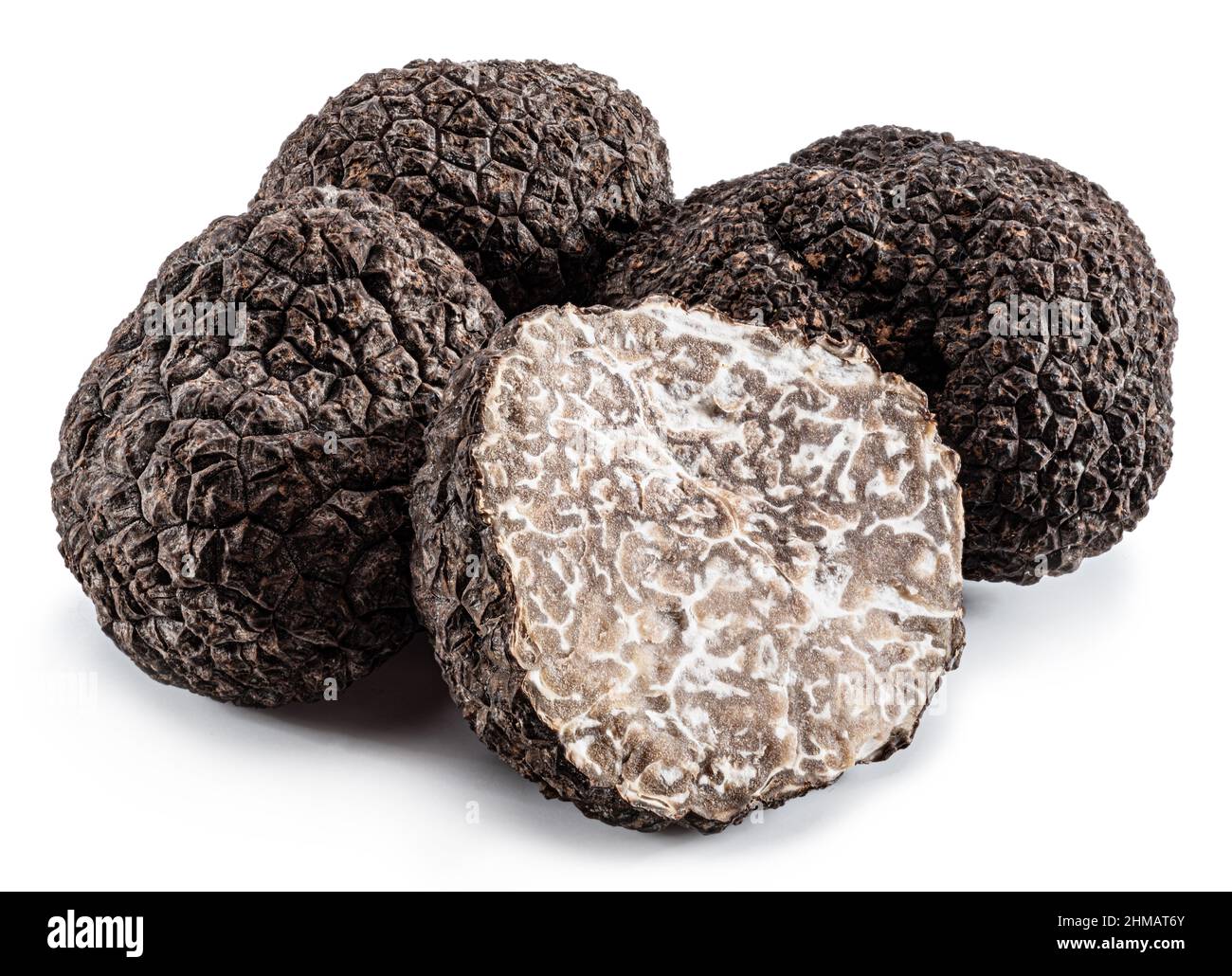 Black winter truffles and truffle cross section on white background. The most famous of the