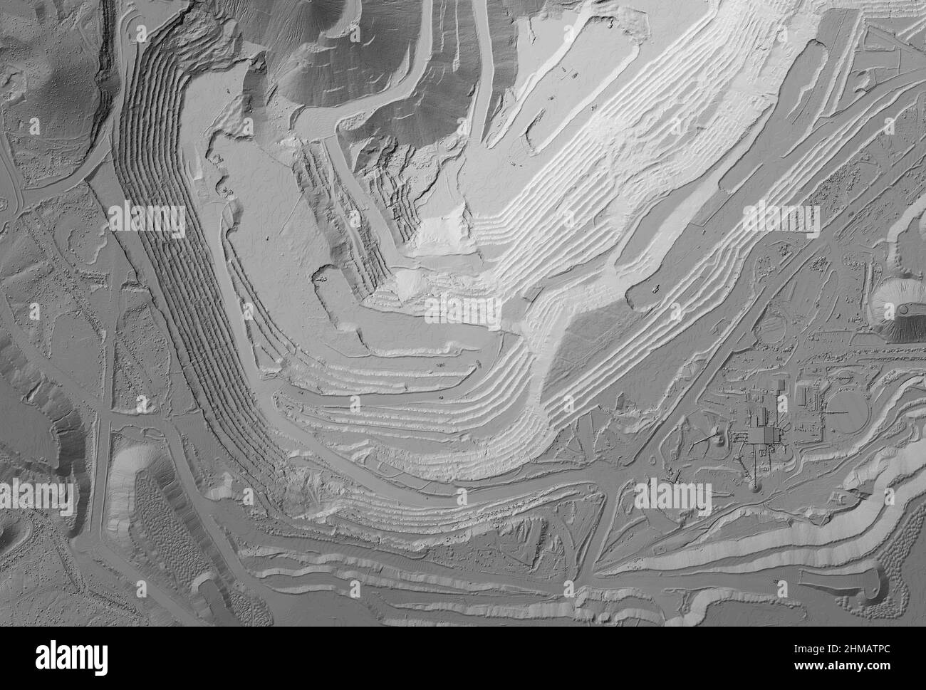 Model of a mine elevation. GIS product made after processing aerial pictures taken from a drone. It shows excavation site with steep rock walls Stock Photo