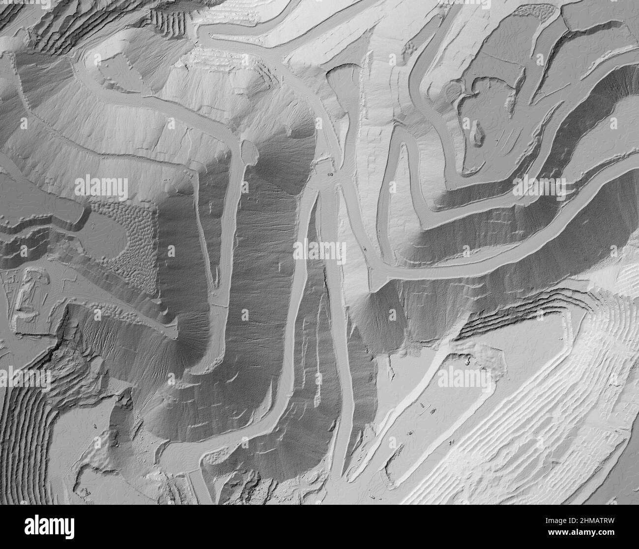 Model of a mine elevation. GIS product made after processing aerial pictures taken from a drone. It shows excavation site with steep rock walls Stock Photo