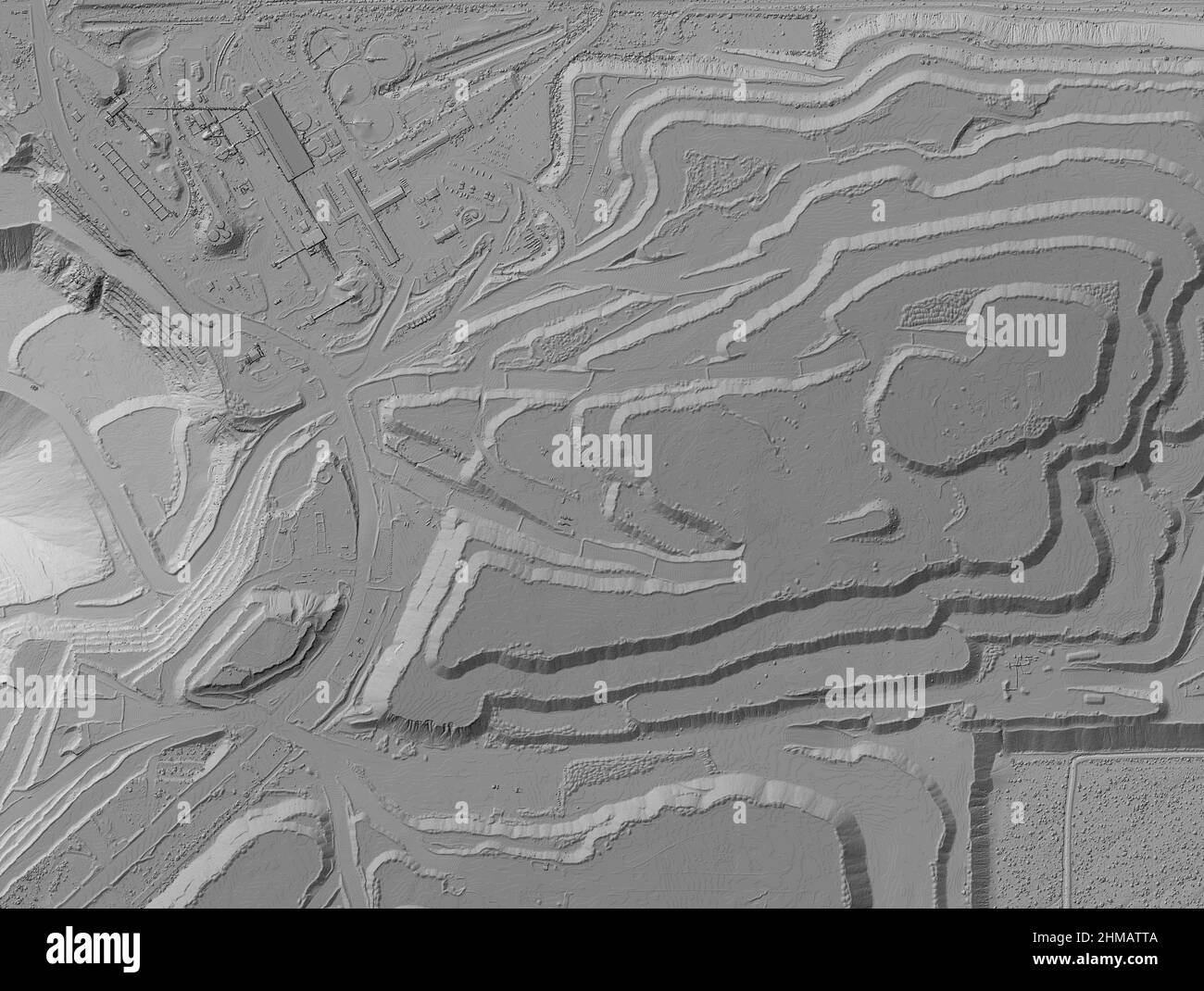 Model of a mine elevation. GIS product made after processing aerial pictures taken from a drone. It shows excavation site with steep rock walls Stock Photo