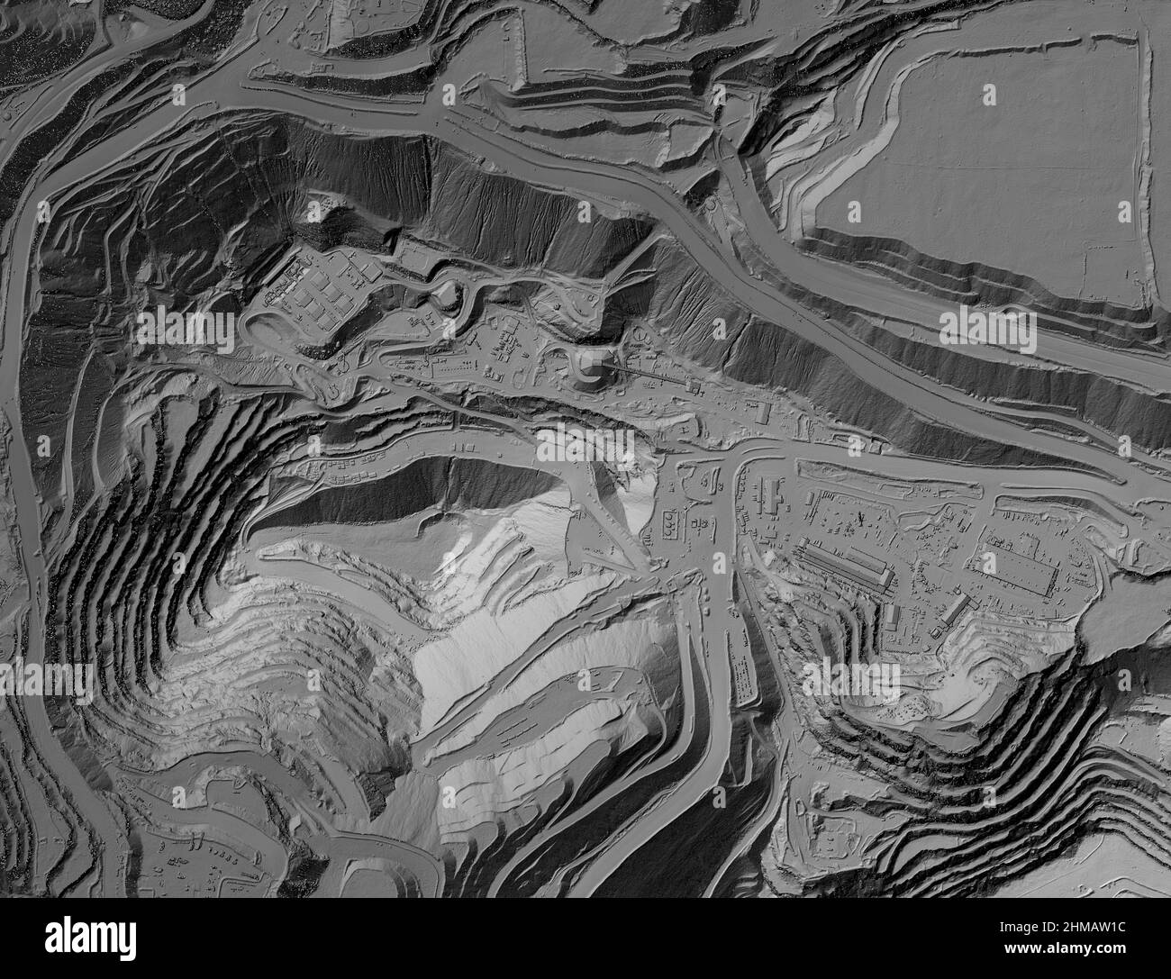 Model of a mine elevation. GIS product made after processing aerial pictures taken from a drone. It shows excavation site with steep rock walls Stock Photo