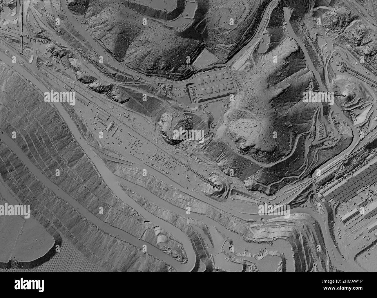Model of a mine elevation. GIS product made after processing aerial pictures taken from a drone. It shows excavation site with steep rock walls Stock Photo