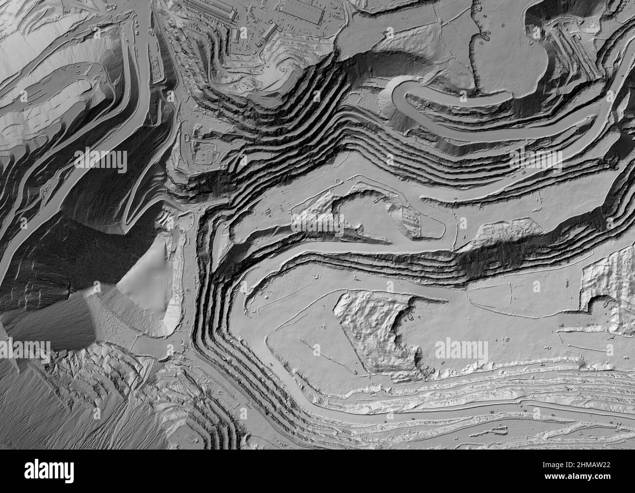 Model of a mine elevation. GIS product made after processing aerial pictures taken from a drone. It shows excavation site with steep rock walls Stock Photo