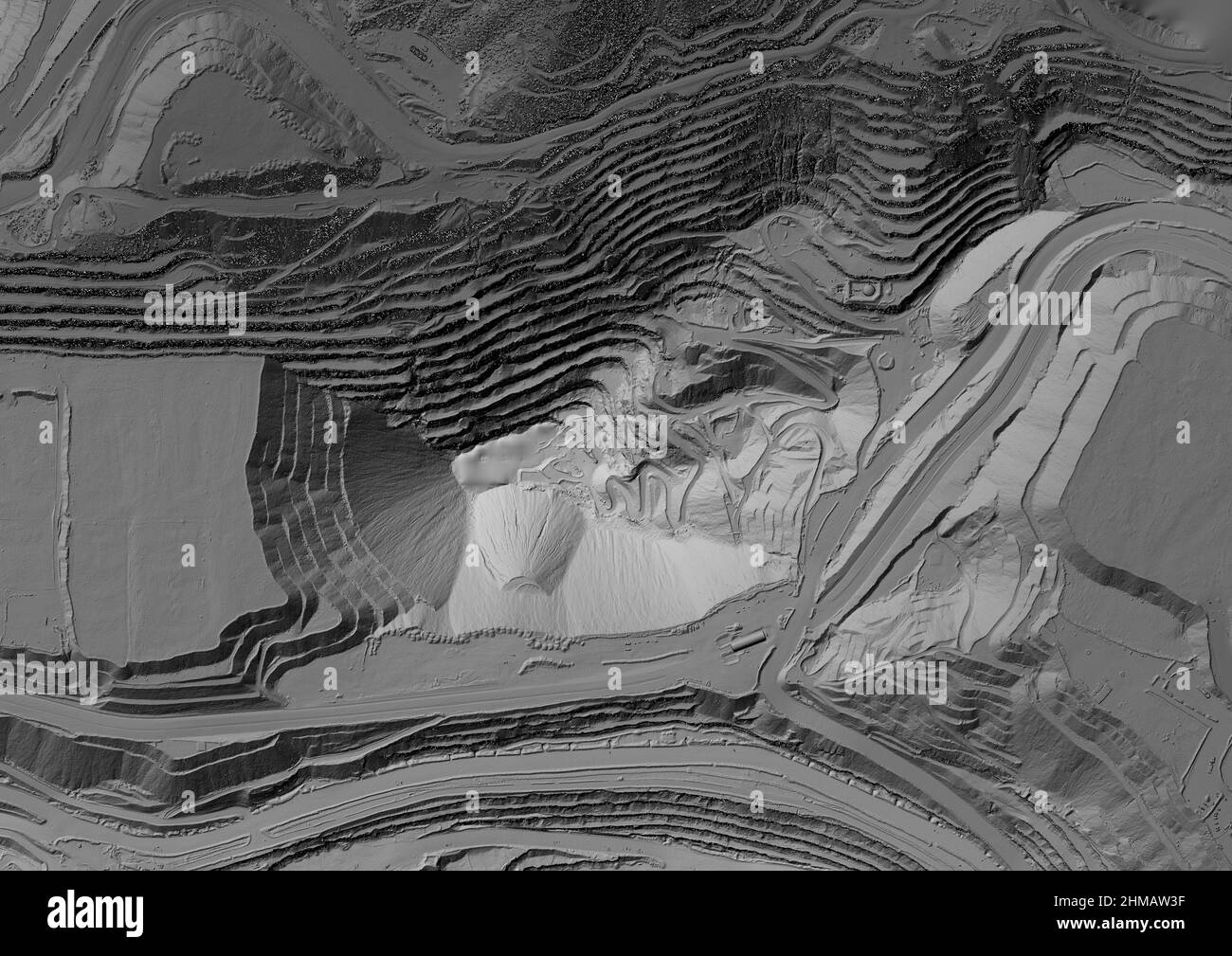 Model of a mine elevation. GIS product made after processing aerial pictures taken from a drone. It shows excavation site with steep rock walls Stock Photo