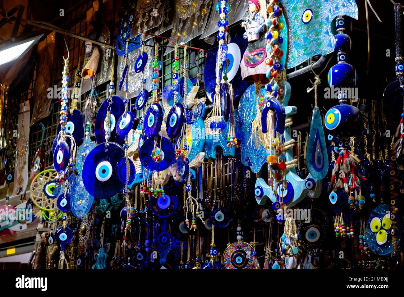 Nazar boncugu or evil eye beads hanging on the shop in Grand Bazaar Istanbul. Souvenirs or gifts from Turkey. Stock Photo