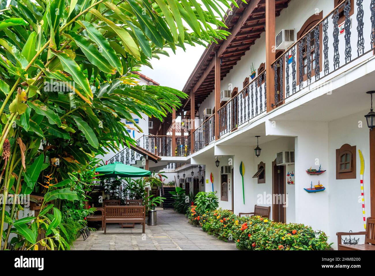 View of rooms and central backyard in the Che Lagarto Hostel. The small business establishment is popular among tourists visiting the town. Stock Photo