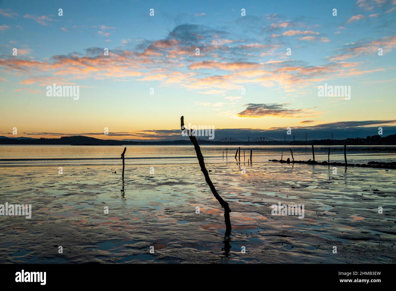 Sunrise over the Firth of Forth in Dalgety Bay with the Forth Bridges in the distance. Stock Photo